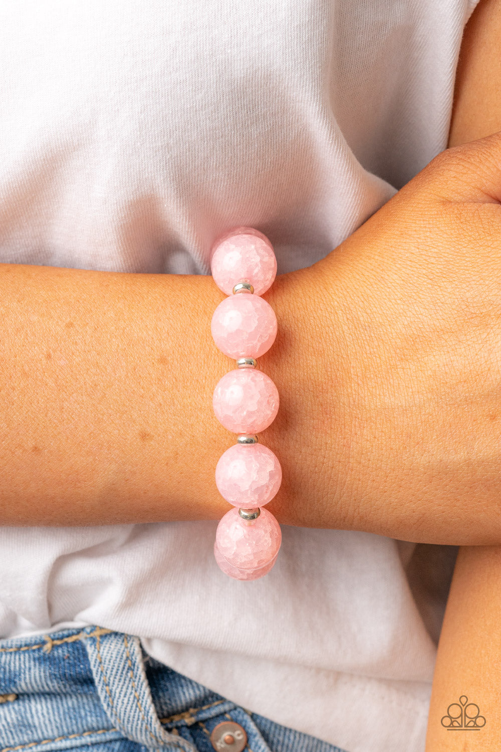 Arctic Affluence Pink Bracelet - Paparazzi Accessories  Infused with dainty silver accents, an oversized collection of crackly pink glass-like beads are threaded along stretchy bands around the wrist for an icy look.  Sold as one individual bracelet.