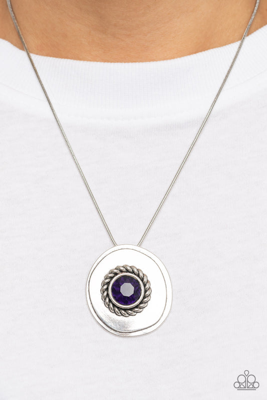 Make Me a MEDALLION-aire - Purple Item #P2RE-PRXX-261XX An oversized purple rhinestone adorns the textured center of an asymmetrical silver disc, creating an edgy medallion at the bottom of a rounded silver snake chain below the collar. Features an adjustable clasp closure.  Sold as one individual necklace. Includes one pair of matching earrings.