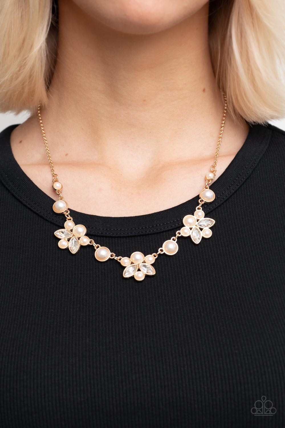 Royally Ever After Gold Necklace - Paparazzi Accessories  Infused with solitaire pearls, dainty clusters of bubbly white pearls and glassy white marquise style rhinestones delicately gather into clustered frames below the collar for an elegantly timeless finish. Features an adjustable clasp closure.  Sold as one individual necklace. Includes one pair of matching earrings.