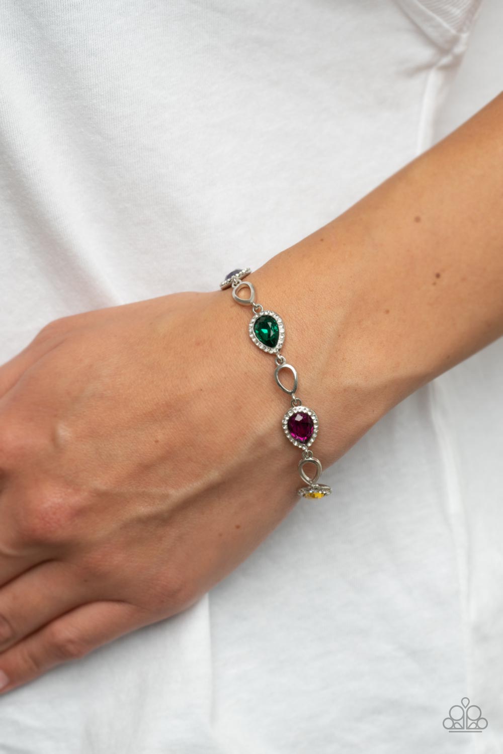 Timelessly Teary Multi Bracelet - Paparazzi Accessories  Bordered in glassy white rhinestones, glittery multicolored teardrop gems link with airy silver teardrop frames around the wrist for a timeless twinkle. Features an adjustable clasp closure.  Sold as one individual bracelet.