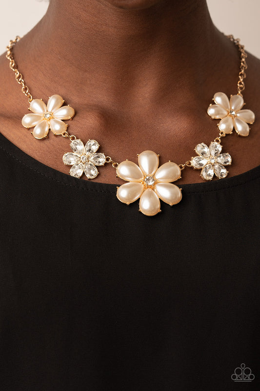 Fiercely Flowering Gold Necklace - Paparazzi Accessories  Featuring glassy white rhinestone centers, bubbly pearl petaled gold flowers gradually increase in size as they alternate with white rhinestone petaled flowers below the collar for a fierce floral fashion. Features an adjustable clasp closure.  Sold as one individual necklace. Includes one pair of matching earrings.