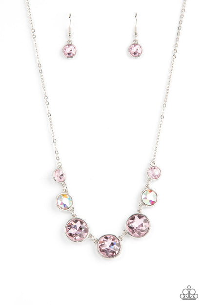 Pampered Powerhouse Pink Necklace - Paparazzi Accessories  Encased in shiny silver frames, a glitzy collection of pink and iridescent gems gradually increase in size as they link below the collar for a flawless finish. Features an adjustable clasp closure.  Sold as one individual necklace. Includes one pair of matching earrings.