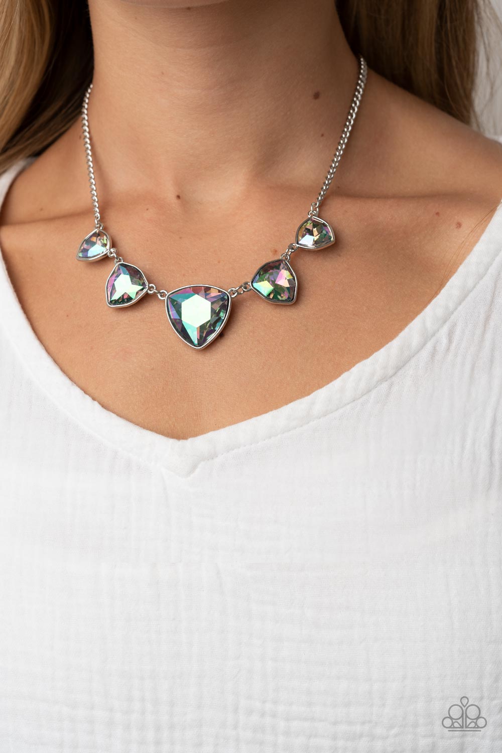 Cosmic Constellations Multi Necklace - Paparazzi Accessories  Encased in sleek silver fittings, an oversized collection of UV geometric gems gradually increase in size as they link below the collar for a stellar statement. Features an adjustable clasp closure. Due to its prismatic palette, color may vary.  Sold as one individual necklace. Includes one pair of matching earrings.