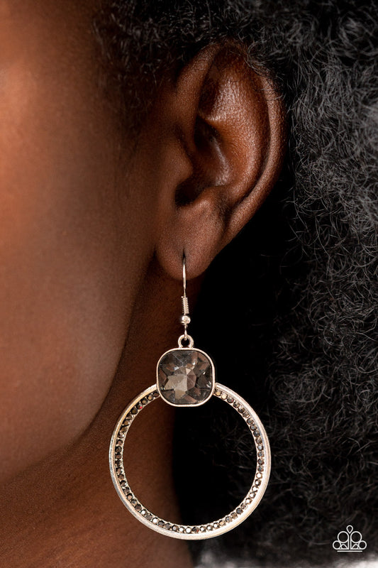 Cheers to Happily Ever After - Silver Item #P5RE-SVXX-324XX An oversized smoky gem sits atop a silver hoop with an inner ring encrusted in glitzy hematite rhinestones, resulting in a timeless twinkle. Earring attaches to a standard fishhook fitting.  Sold as one pair of earrings.