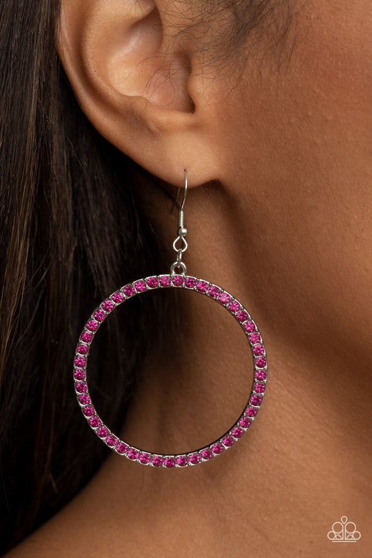 Head-Turning Halo Pink Earring - Paparazzi Accessories  The front of an oversized silver ring is encrusted in glitzy Fuchsia Fedora rhinestones, resulting in a head-turning hoop. Earring attaches to a standard fishhook fitting.  Sold as one pair of earrings.