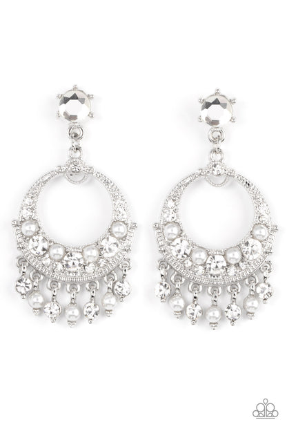 Marrakesh Request White Post Earring - Paparazzi Accessories  White pearl and white rhinestone dotted frames dance from the bottom of an ornate silver hoop encrusted in matching bubbly accents, resulting in a timeless fringe at the bottom of a solitaire white rhinestone. Earring attaches to a standard fishhook fitting.  Sold as one pair of post earrings.