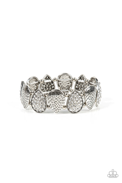 Playing Favorites White Bracelet - Paparazzi Accessories  Infused with pairs of silver beads, a decorative collection of hammered silver teardrops, and white encrusted silver teardrops alternate along stretchy bands around the wrist for an edgy flair.  Sold as one individual bracelet.
