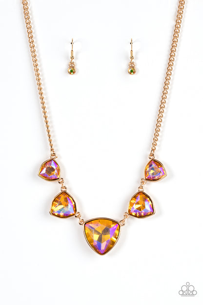 Cosmic Constellations Gold Necklace - Paparazzi Accessories  Encased in sleek gold fittings, an oversized collection of UV geometric gems gradually increase in size as they link below the collar for a golden statement. Features an adjustable clasp closure.  Sold as one individual necklace. Includes one pair of matching earrings.
