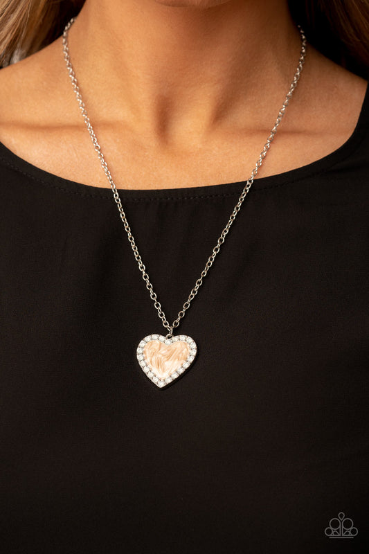 Heart Full of Luster Brown Necklace - Paparazzi Accessories  Bordered in a row of opal white rhinestones, a silver frame is painted in a glossy brown finish at the bottom of a silver chain for a flirtatious finish. Features an adjustable clasp closure.  Sold as one individual necklace. Includes one pair of matching earrings.