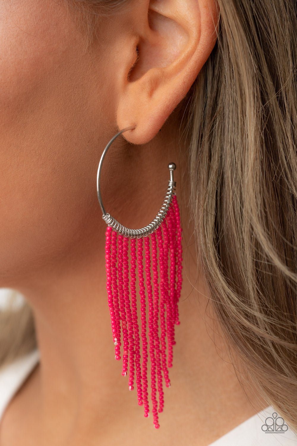 Saguaro Breeze Pink Hoop Earring - Paparazzi Accessories  Strands of dainty pink seed beads stream out from the bottom of a classic silver hoop, resulting in a flirtatiously tasseled look. Earring attaches to a standard post fitting. Hoop measures approximately 1 1/2" in diameter.  Sold as one pair of hoop earrings.