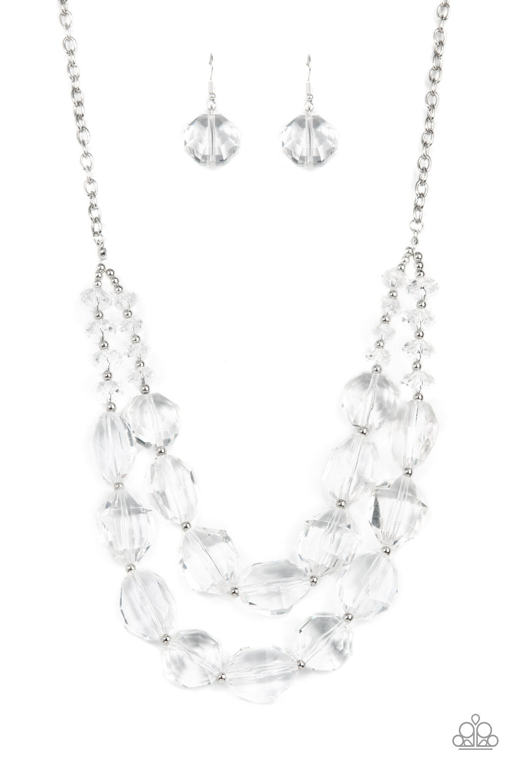 Icy Illumination White Necklace - Paparazzi Accessories  Separated by dainty silver beads, an icy collection of oversized and faceted white gems are threaded along invisible wires below the collar, resulting in prismatic layers. Features an adjustable clasp closure.  Sold as one individual necklace. Includes one pair of matching earrings.