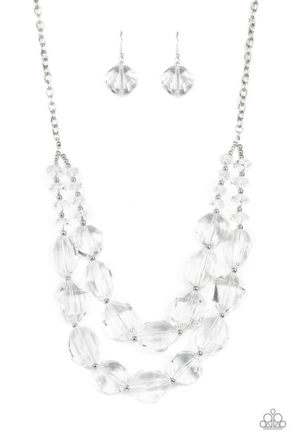 Icy Illumination White Necklace - Paparazzi Accessories  Separated by dainty silver beads, an icy collection of oversized and faceted white gems are threaded along invisible wires below the collar, resulting in prismatic layers. Features an adjustable clasp closure.  Sold as one individual necklace. Includes one pair of matching earrings.