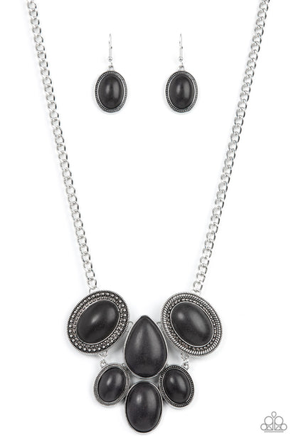 All-Natural Nostalgia - Black Item #P2ST-BKXX-193XX Featuring an assortment of studded, textured, and smooth silver frames, a grounding combination of oversized oval and teardrop black stones links into an exaggerated earthy pendant below the collar for an artisan inspired fashion. Features an adjustable clasp closure.  Sold as one individual necklace. Includes one pair of matching earrings.