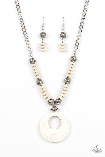 Oasis Goddess White Necklace - Paparazzi Accessories  Infused with dainty silver accents, mismatched silver beads and white stone discs are threaded along an invisible wire below the collar. An oversized white stone pendant swings from the center of the earthy strand, creating a natural pop of seasonal inspiration. Features an adjustable clasp closure.  Sold as one individual necklace. Includes one pair of matching earrings.
