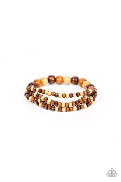 Oceania Oasis Brown Bracelet - Paparazzi Accessories  Varying in natural wooden finishes, stretchy strands of dainty wooden beads attach to a single row of oversized wooden beads around the wrist for an earthy spin on the homespun trend.  Sold as one individual bracelet.