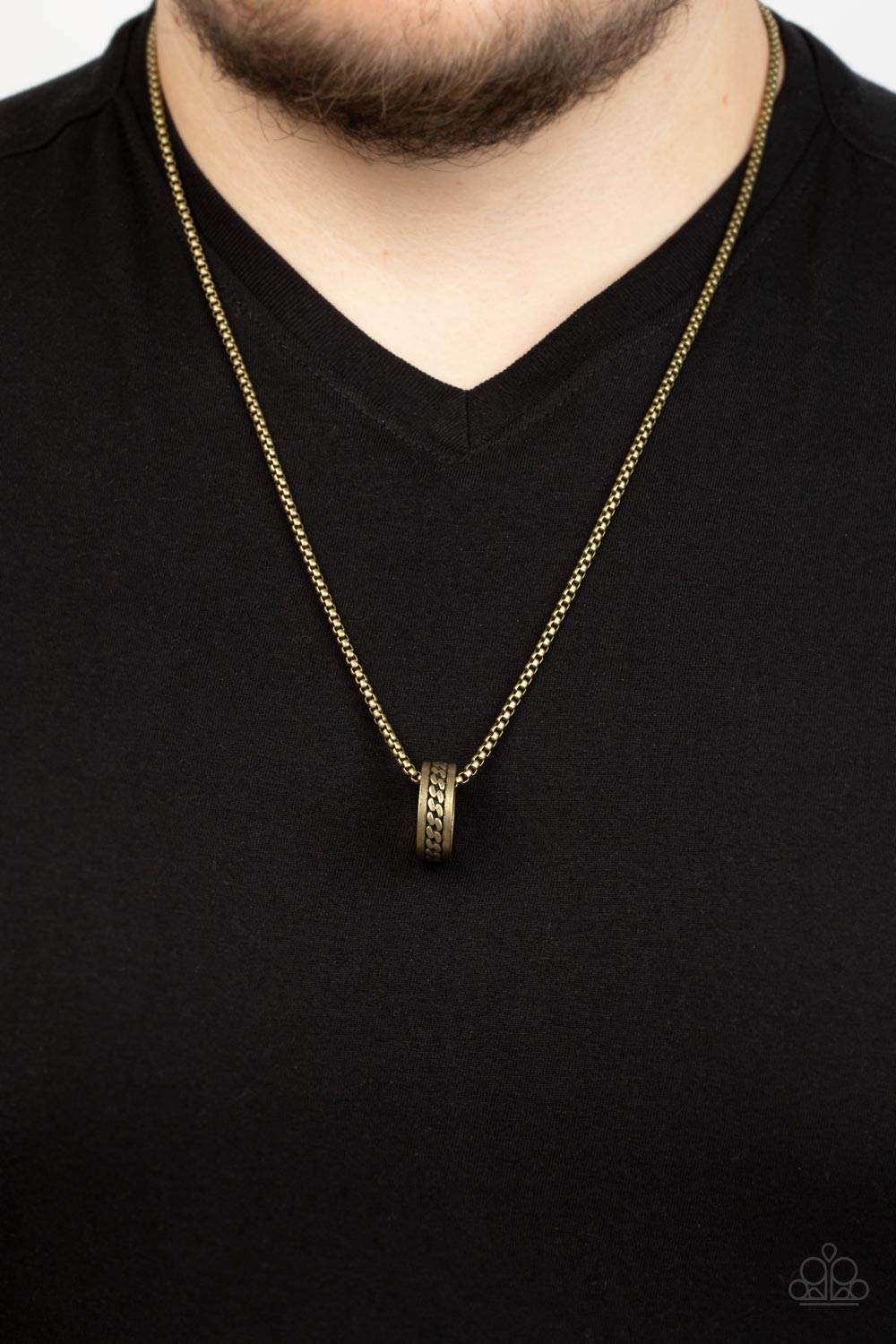 Emotion Potion Brass Urban Necklace - Paparazzi Accessories  Embossed in a band of zigzagging texture, an antiqued brass ring glides along a strand of brass box chain across the chest in a rustic fashion. Features an adjustable clasp closure.  Sold as one individual necklace.
