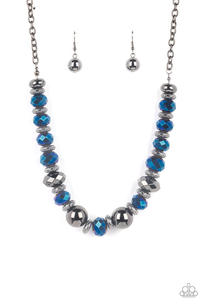 Interstellar Influencer Blue Necklace - Paparazzi Accessories  A dramatic assortment of oversized gunmetal beads, textured gunmetal rings, and faceted metallic blue gems delicately glides along an invisible wire below the collar, resulting in a stellar sparkle. Features an adjustable clasp closure. Includes one pair of matching earrings.