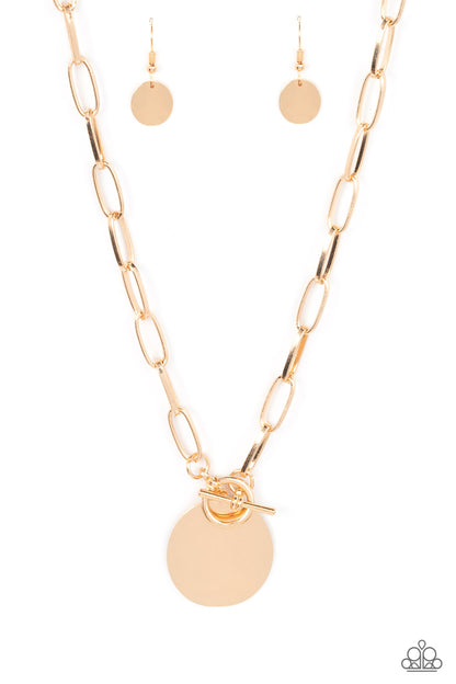 Tag Out Gold Necklace - Paparazzi Accessories  An oversized oval gold disc swings from the bottom of a substantial oval linked gold chain, resulting in a gritty industrial pendant below the collar. Features a toggle closure.  Sold as one individual necklace. Includes one pair of matching earrings.