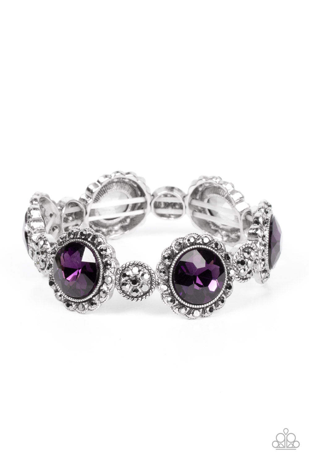 Palace Property Purple Bracelet - Paparazzi Accessories  An oversized purple rhinestone adorns the center of a hematite rhinestone petaled floral frame. Infused with hematite dotted silver accents, the glitzy floral frames sparkle along stretchy bands around the wrist for a glamorous finish.  Sold as one individual bracelet.