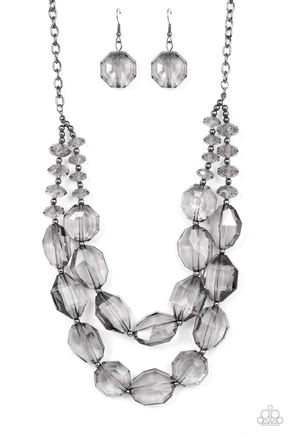 Icy Illumination Black Necklace - Paparazzi Accessories  Separated by dainty silver beads, an icy collection of oversized and faceted smoky gems are threaded along invisible wires below the collar, resulting in prismatic layers. Features an adjustable clasp closure.  Sold as one individual necklace. Includes one pair of matching earrings.