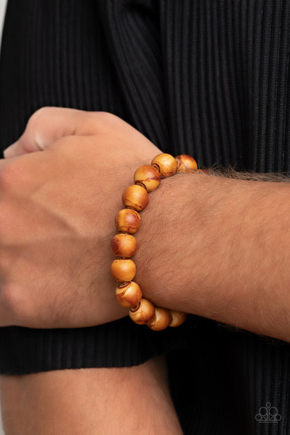 Totally Timber Mill Brown Urban Bracelet - Paparazzi Accessories  Featuring a distressed finish, an earthy collection of natural-colored wood beads are threaded along a stretchy band around the wrist for a rustic flair.  Sold as one individual bracelet.