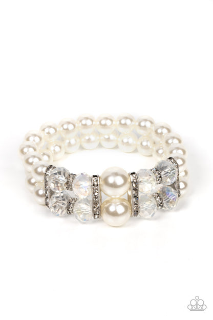 Timelessly Tea Party White Bracelet - Paparazzi Accessories  Held together by white rhinestone encrusted silver frames, a stretchy pair of bubbly pearl bracelets are infused with white rhinestone encrusted silver rings, iridescent crystal-like beads, and oversized white pearls for a timeless finish.  Sold as one individual bracelet.