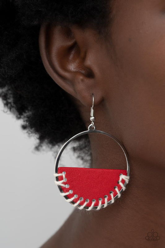 Lavishly Laid Back Red Earring - Paparazzi Accessories﻿  White cording is threaded through the bottom of a half moon piece of red leather, anchoring the earthy accent in place inside a glistening silver hoop for an earthy flair. Earring attaches to a standard fishhook fitting.  Sold as one pair of earrings.