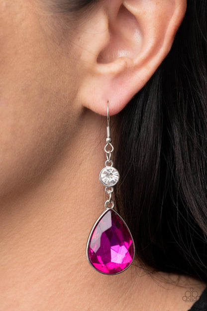 Smile for the Camera Pink Earring - Paparazzi Accessories  A dramatically oversized Fuchsia Fedora teardrop gem sparkles from the bottom of a stunning solitaire white rhinestone, resulting in a jaw-dropping dazzle. Earring attaches to a standard fishhook fitting.  Sold as one pair of earrings.