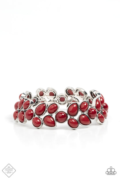Marina Romance Red Bracelet - Paparazzi Accessories  A flourishing collection of red oval, round, and teardrop beads coalesce into abstract floral-inspired frames. The enchanting frames, threaded along stretchy bands, add a vivacious pop of color around the wrist.  Sold as one individual bracelet.