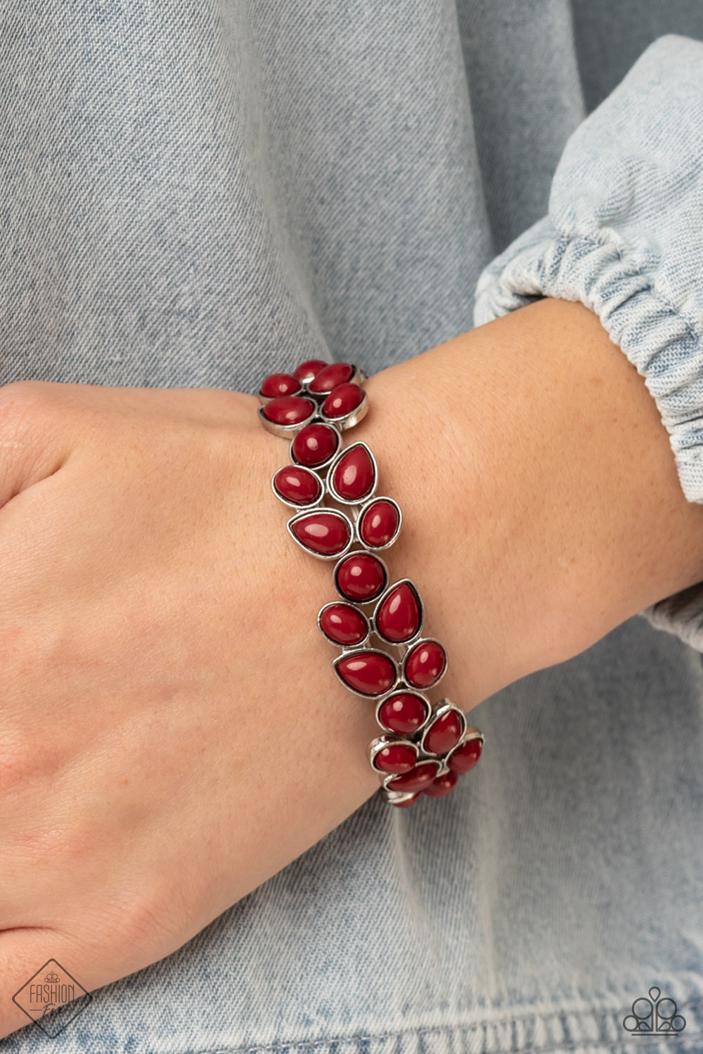 Marina Romance Red Bracelet - Paparazzi Accessories  A flourishing collection of red oval, round, and teardrop beads coalesce into abstract floral-inspired frames. The enchanting frames, threaded along stretchy bands, add a vivacious pop of color around the wrist.  Sold as one individual bracelet.
