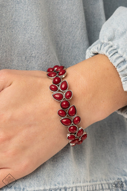 Marina Romance Red Bracelet - Paparazzi Accessories  A flourishing collection of red oval, round, and teardrop beads coalesce into abstract floral-inspired frames. The enchanting frames, threaded along stretchy bands, add a vivacious pop of color around the wrist.  Sold as one individual bracelet.