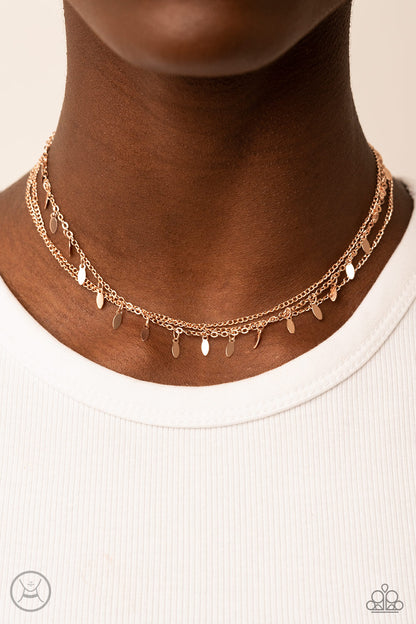 Monochromatic Magic Rose Gold Choker Necklace - Paparazzi Accessories  Infused with two dainty rows of rose gold chains, a row of rose gold oval discs glisten around the neck for a playful look. Features an adjustable clasp closure.  Sold as one individual choker necklace. Includes one pair of matching earrings.
