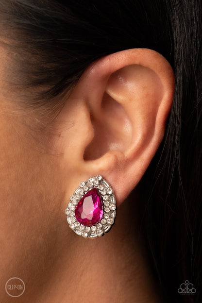 Haute Happy Hour Pink Clip-On Earring - Paparazzi Accessories  An oversized Fuchsia Fedora teardrop gem is elegantly bordered in glassy white rhinestones atop a decorative silver frame, culminating into a timeless twinkle. Earring attaches to a standard clip-on fitting.  Sold as one pair of clip-on earrings.