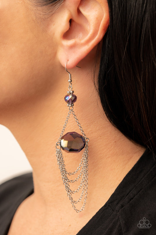Ethereally Extravagant Purple Earring - Paparazzi Accessories  Tiers of dainty silver chains delicately layer from an oversized oval iridescent purple gem that is suspended from a faceted matching purple crystal-like bead, resulting in an ethereal chandelier. Earring attaches to a standard fishhook fitting.  Sold as one pair of earrings.