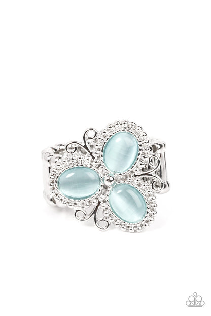 Bewitched Blossoms Blue Ring - Paparazzi Accessories  Three oval blue cat's eye stones are encased in studded silver fittings featuring filigree accents, blooming into a magical floral centerpiece atop the finger. Features a stretchy band for a flexible fit.  Sold as one individual ring.