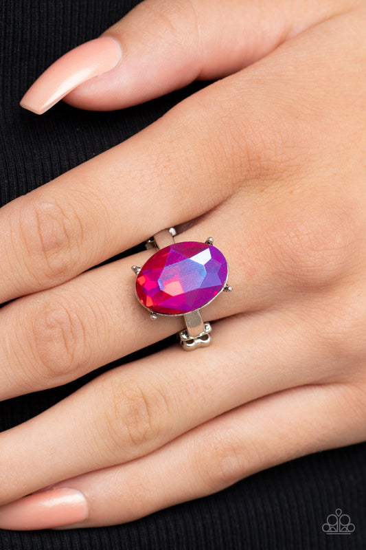 Updated Dazzle Pink Ring - Paparazzi Accessories  A stunning faceted iridescent pink gem, set in edgy pronged fittings, creates a glamorous show-stopping centerpiece atop sleek silver bands. Features a dainty stretchy band for a flexible fit.  Sold as one individual ring.