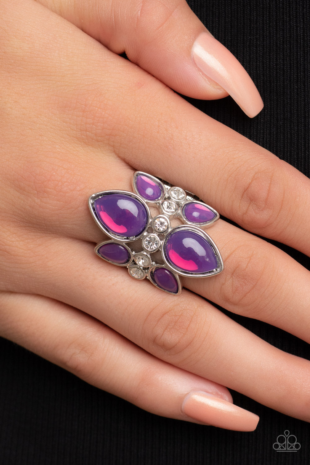 TRIO Tinto Purple Ring - Paparazzi Accessories  Crowns of glassy purple teardrop beads fan out from a center of glassy white rhinestones, coalescing into an ethereal centerpiece atop the finger. Features a stretchy band for a flexible fit.  Sold as one individual ring.