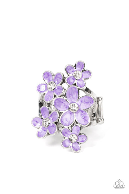 Boastful Blooms Purple Ring - Paparazzi Accessories  Dotted with dainty white rhinestone centers, a bouquet of shiny purple flowers blooms across the finger for a sensational seasonal look. Features a stretchy band for a flexible fit.  Sold as one individual ring.