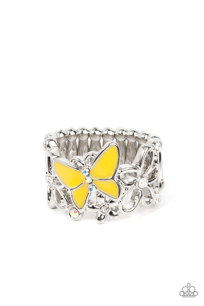 All FLUTTERED Up Yellow Ring - Paparazzi Accessories  Glassy white and iridescent rhinestones are sprinkled across a band of airy silver flowers and a shiny Illuminating butterfly, invoking a whimsical fashion atop the finger. Features a stretchy band for a flexible fit.  Sold as one individual ring.