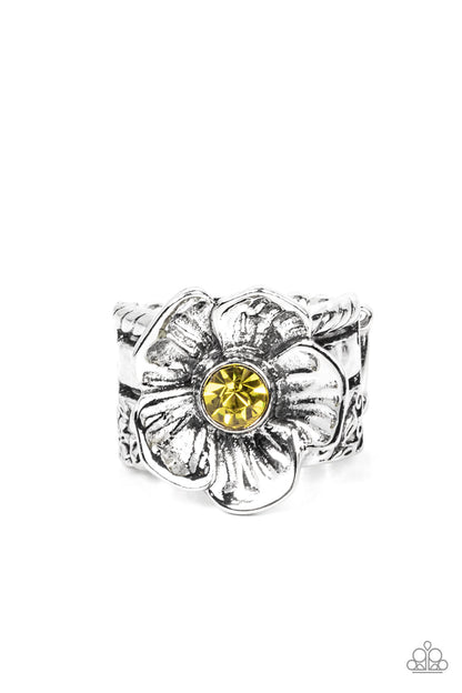 Prismatically Petunia Yellow Ring - Paparazzi Accessories  Textured silver petals gently gather around a sparkling yellow rhinestone center, blooming into a dazzling floral centerpiece atop the finger. Features a stretchy band for a flexible fit.  Sold as one individual ring.