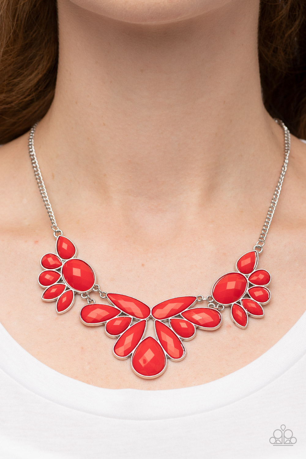 A Passing FAN-cy Red Necklace - Paparazzi Accessories  A dewy collection of oval, teardrop, and marquise red beads fans out below the collar, blooming into enchanting floral frames that delicately link into a whimsical centerpiece.  Sold as one individual necklace. Includes one pair of matching earrings.