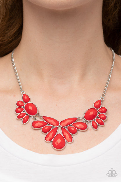 A Passing FAN-cy Red Necklace - Paparazzi Accessories  A dewy collection of oval, teardrop, and marquise red beads fans out below the collar, blooming into enchanting floral frames that delicately link into a whimsical centerpiece.  Sold as one individual necklace. Includes one pair of matching earrings.
