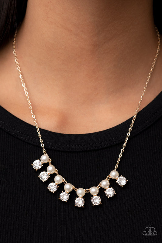 Dashingly Duchess Gold Necklace - Paparazzi Accessories  Encased in sleek gold fittings, pairs of white pearls and white rhinestones elegantly stack below the collar for a romantically refined flair. Features an adjustable clasp closure.  Sold as one individual necklace. Includes one pair of matching earrings.