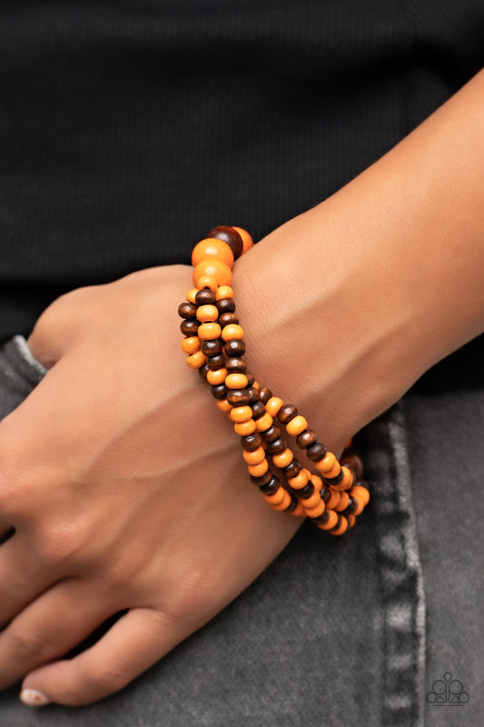 Oceania Oasis Orange Wooden Bracelet - Paparazzi Accessories  Stretchy strands of dainty brown and orange wood beads attach to a single strand of oversized brown and orange wood beads, resulting in colorful layers around the wrist.  Sold as one individual bracelet.