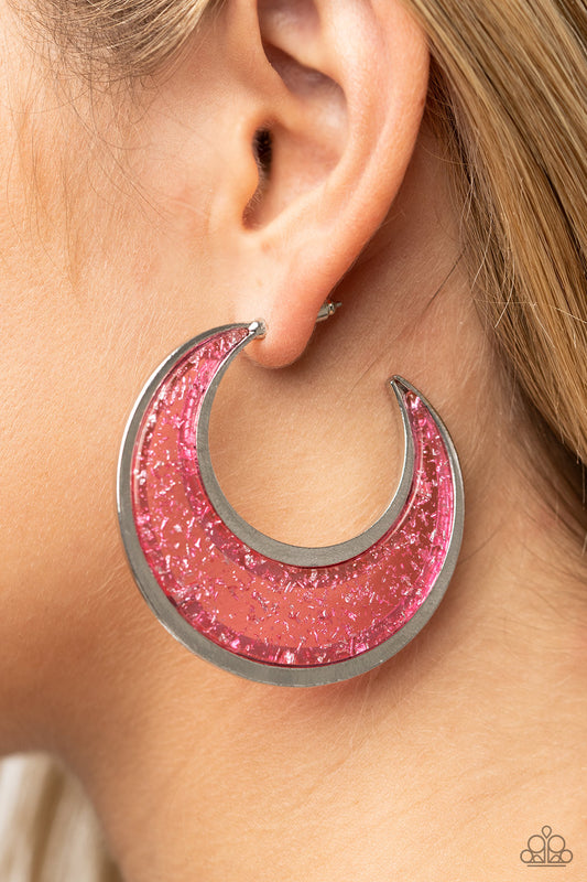 Charismatically Curvy Pink Hoop Earring - Paparazzi Accessories  Flecked in silver shavings, a glistening pink acrylic half moon frame is bordered with flat shiny bars that coalesce into a curvaceous hoop. Earring attaches to a standard post fitting. Hoop measures approximately 2" in diameter.  Sold as one pair of hoop earrings.
