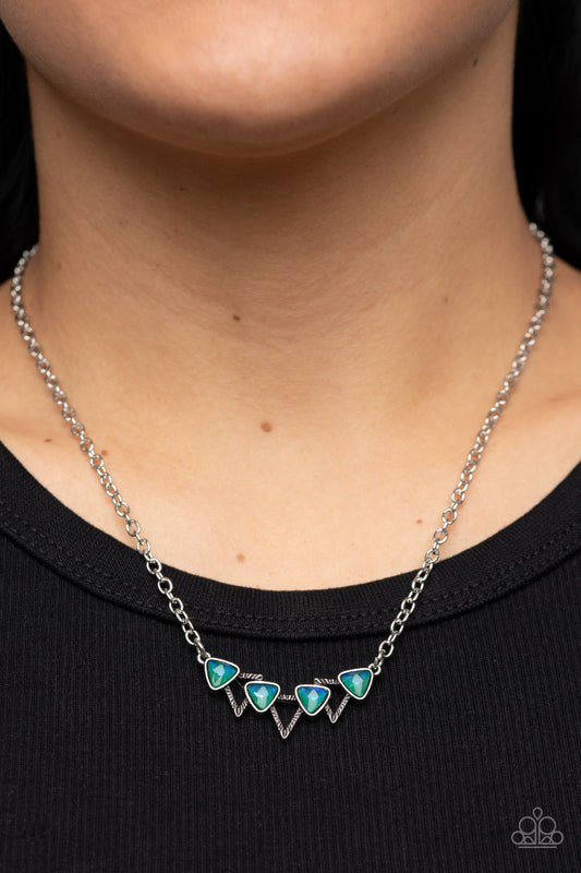 Pyramid Prowl Multi Necklace - Paparazzi Accessories  A staggered row of iridescent triangular gems stack across the front of a row of textured silver triangular frames, resulting in a stellar sparkle below the collar. Features an adjustable clasp closure.  Sold as one individual necklace. Includes one pair of matching earrings.