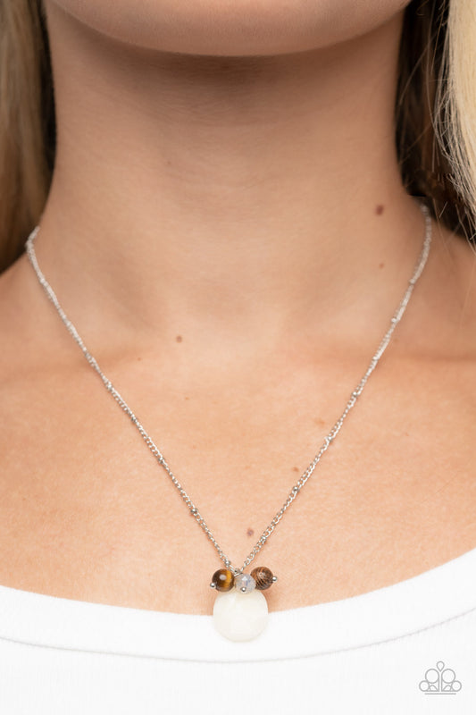 Cherokee Canyon White Necklace - Paparazzi Accessories  An earthy cluster of wooden, crystal-like, and tiger's eye stone beads joins an enchanting quartz-like teardrop at the bottom of a dainty silver satellite chain, resulting in a tranquil pendant below the collar. Features an adjustable clasp closure.  Sold as one individual necklace. Includes one pair of matching earrings.