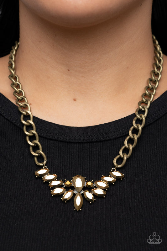 Come at Me Brass Necklace - Paparazzi Accessories  Glitzy marquise cut aurum rhinestones fan out from the bottom of an oversized teardrop aurum rhinestone, resulting in a gritty pendant at the bottom of a chunky brass chain for a sassy statement. Features an adjustable clasp closure.  Sold as one individual necklace. Includes one pair of matching earrings.