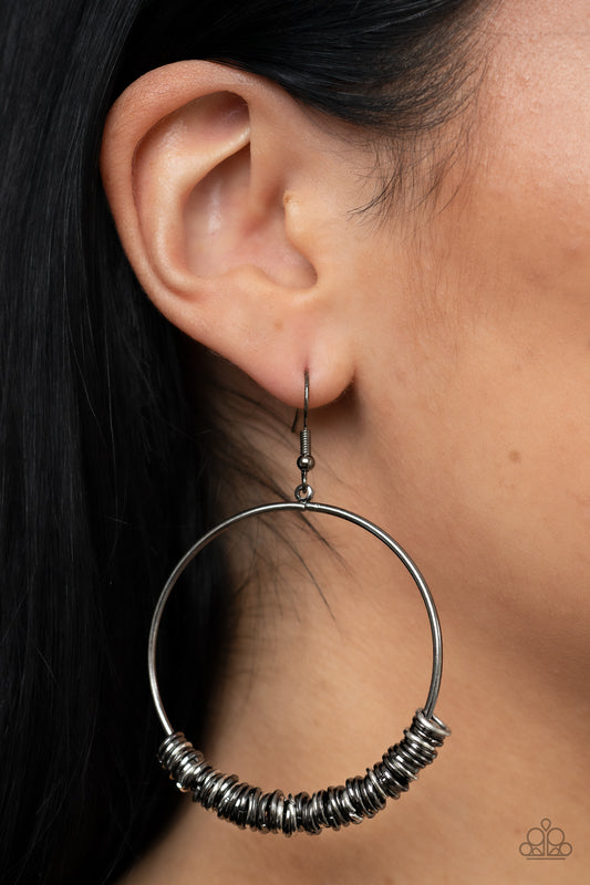 Retro Ringleader - Multi Item #P5IN-MTXX-031XX An abundance of miniature gunmetal and silver rings slide around a simple gunmetal front-facing hoop, resulting in a polished industrial vibe. Earring attaches to a standard fishhook fitting.  Sold as one pair of earrings.