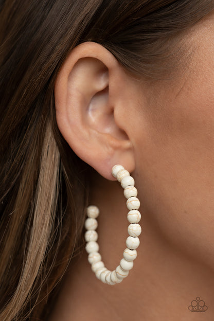 Rural Retrograde White Stone Hoop Earring - Paparazzi Accessories  Earthy white stone beads are threaded along a dainty wire hoop, resulting in an earthy flair. Earring attaches to a standard post fitting. Hoop measures approximately 2" in diameter.  Sold as one pair of hoop earrings.  P5HO-WTXX-103XX
